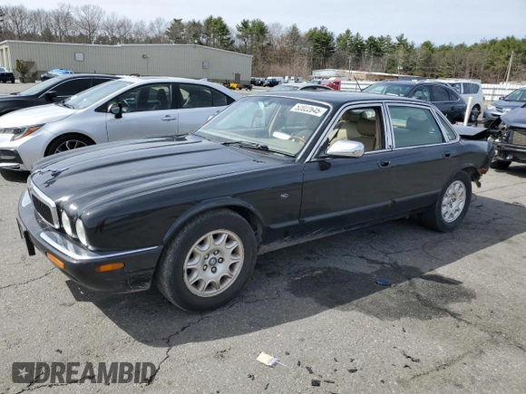 2002 Jaguar XJ 8 with VIN SAJDA14C62LF40435, listed as a Copart auction lot 52022645 with 153,703 mi miles and Salvage title. Bid and sale history available at DreamBid. Image 1.