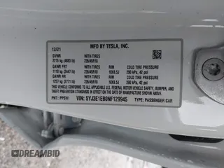 2022 Tesla Model 3 Long Range with VIN 5YJ3E1EB0NF129945, listed as a IAAI auction lot 41965531 with 59,162 mi miles and . Bid and sale history available at DreamBid. Image 9.
