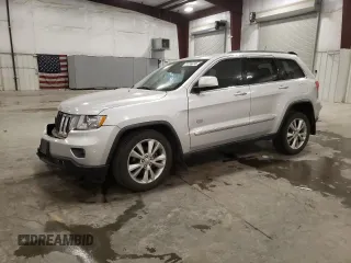 2011 Jeep Grand Cherokee 70th Anniversary with VIN 1J4RR4GG0BC666357, listed as a Copart auction lot 71726674 with 122,802 mi miles and Salvage Title. Bid and sale history available at carsss.com. Image 1.