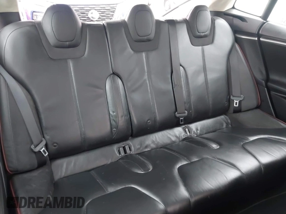 2013 Tesla Model S with VIN 5YJSA1CN0DFP20053, listed as a IAAI auction lot 41470660 with 61,568 mi miles and . Bid and sale history available at DreamBid. Image 8.