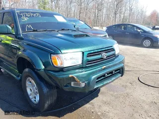 2000 Toyota 4Runner SR5 with VIN JT3HN86R1Y0323093, listed as a IAAI auction lot 41769405 with 156,905 mi miles. Bid and sale history available at carsss.com. Image 6.