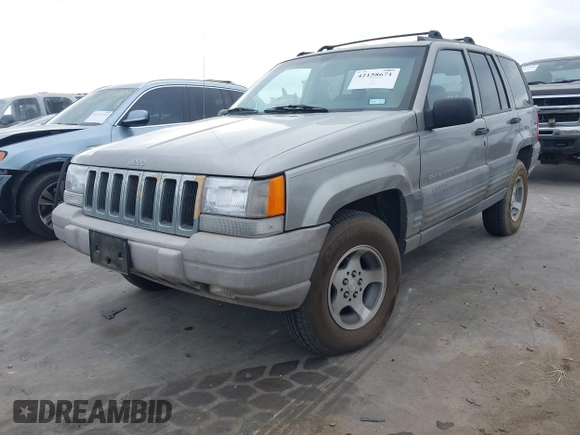 1998 Jeep Grand Cherokee Laredo with VIN 1J4FX58S6WC354101, listed as a IAAI auction lot 42158671 with 289,318 mi miles and . Bid and sale history available at DreamBid. Image 2.