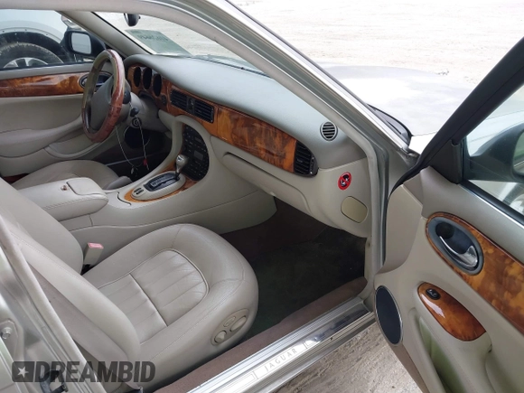 1999 Jaguar XJ with VIN SAJHX1043XC856474, listed as a IAAI auction lot 41626649 with 103,266 mi miles and . Bid and sale history available at DreamBid. Image 5.