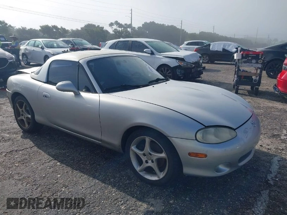 2003 Mazda MX-5 Miata Cloth with VIN JM1NB353730311899, listed as a IAAI auction lot 41929811 with 99,589 mi miles and . Bid and sale history available at DreamBid. Image 1.