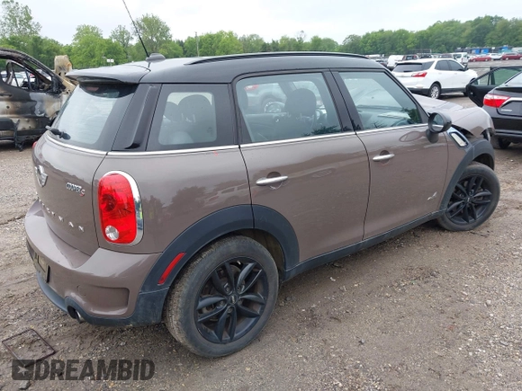 2014 MINI Countryman S with VIN WMWZC5C55EWP41717, listed as a IAAI auction lot 42324347 with Not provided miles and . Bid and sale history available at DreamBid. Image 4.