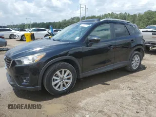 2016 Mazda CX-5 Touring z VIN JM3KE2CYXG0719345, wystawiony jako Copart lot #53733705 z przebiegiem 198 277 mil mil oraz Szkody całkowita. Historia ofert i sprzedaży dostępna na DreamBid. Obrazek 1.