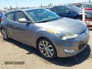 2013 Hyundai Veloster w/Red Int with VIN KMHTC6AD1DU175604, listed as a IAAI auction lot 42826695 with 193,442 mi miles and . Bid and sale history available at DreamBid. Image 1.