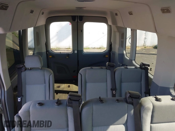 2015 Ford Transit Passenger XL z VIN 1FBAX2CG7FKA75719, wystawiony jako IAAI lot #42135118 z przebiegiem Nie podano mil oraz . Historia ofert i sprzedaży dostępna na DreamBid. Obrazek 19.