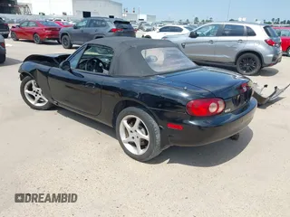2002 Mazda MX-5 Miata Cloth with VIN JM1NB353520221312, listed as a IAAI auction lot 42410028 with 99,375 mi miles and . Bid and sale history available at DreamBid. Image 3.
