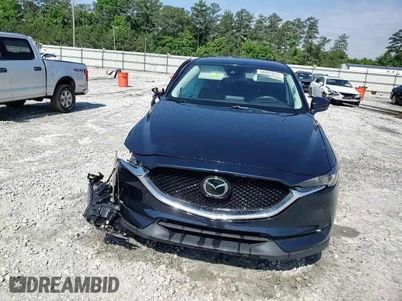 2018 Mazda CX-5 Grand Touring z VIN JM3KFADM5J1420690, wystawiony jako Copart lot #56897875 z przebiegiem 46 483 mil mil oraz Szkoda całkowita • Salvage title. Historia ofert i sprzedaży dostępna na DreamBid. Obrazek 13.