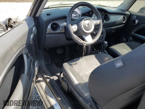 2006 MINI Hardtop with VIN WMWRC33586TJ77908, listed as a Copart auction lot 55095525 with 143,810 mi miles and Salvage title. Bid and sale history available at DreamBid. Image 8.