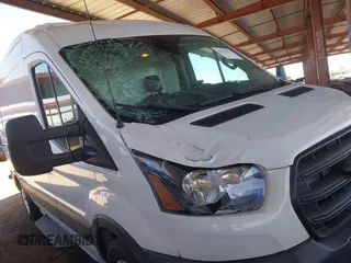 2020 Ford Transit Cargo with VIN 1FTBR1C8XLKB20144, listed as a IAAI auction lot 42141037 with 87,147 mi miles and . Bid and sale history available at carsss.com. Image 6.