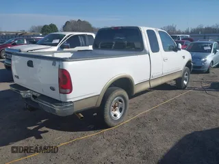 1999 Ford F-150 XL with VIN 1FTRX18L3XKB33860, listed as a IAAI auction lot 41664761 with 305,767 mi miles. Bid and sale history available at carsss.com. Image 4.