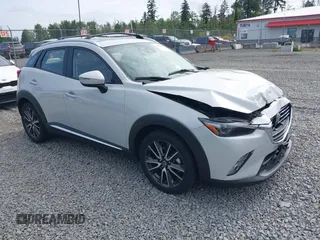2017 Mazda CX-3 Grand Touring z VIN JM1DKFD70H0159621, wystawiony jako IAAI lot #42331482 z przebiegiem 55 166 mil mil oraz . Historia ofert i sprzedaży dostępna na DreamBid. Obrazek 1.