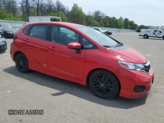 2018 Honda Fit Sport z VIN 3HGGK5H67JM705280, wystawiony jako Copart lot #59912425 z przebiegiem 193 253 mil mil oraz Czysty tytuł • Clean title. Historia ofert i sprzedaży dostępna na DreamBid. Obrazek 4.