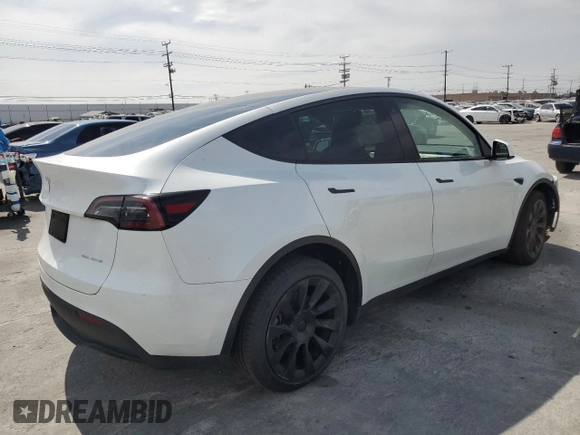 2023 Tesla Model Y Long Range z VIN 7SAYGDEE8PA030286, wystawiony jako Copart lot #50945465 z przebiegiem 43 676 mil mil oraz Szkoda całkowita • Salvage title. Historia ofert i sprzedaży dostępna na DreamBid. Obrazek 3.