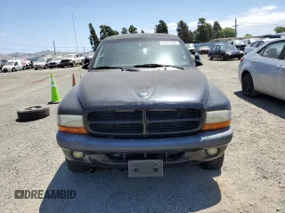 2001 Dodge Dakota Sport z VIN 1B7HG2AN61S316996, wystawiony jako Copart lot #58677535 z przebiegiem 164 628 mil mil oraz Tytuł czysty. Historia ofert i sprzedaży dostępna na DreamBid. Obrazek 5.