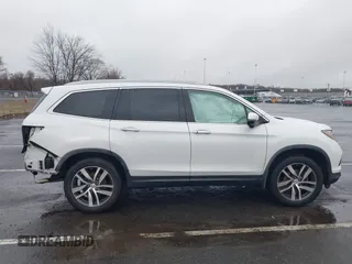 2016 Honda Pilot Touring with VIN 5FNYF6H95GB062089, listed as a IAAI auction lot 41810378 with 74,704 mi miles and . Bid and sale history available at DreamBid. Image 6.