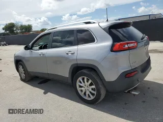 2016 Jeep Cherokee Limited with VIN 1C4PJMDB5GW244734, listed as a Copart auction lot 64608765 with 166,953 mi miles and Salvage title. Bid and sale history available at DreamBid. Image 2.