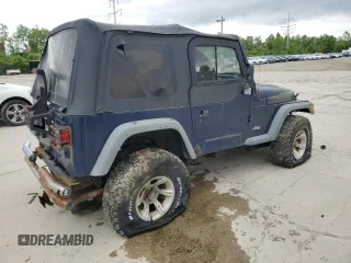 2000 Jeep Wrangler Sport z VIN 1J4FA49S1YP713523, wystawiony jako Copart lot #58076745 z przebiegiem 117 112 mil mil oraz Czysty tytuł • Clean title. Historia ofert i sprzedaży dostępna na DreamBid. Obrazek 3.