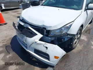 2014 Chevrolet Cruze 1LT with VIN 1G1PC5SB4E7354774, listed as a IAAI auction lot 42104388 with 136,532 mi miles and . Bid and sale history available at DreamBid. Image 6.