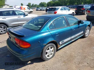 2003 Oldsmobile Alero GL1 z VIN 1G3NL52F53C153441, wystawiony jako IAAI lot #39799738 z przebiegiem 180 025 mil mil oraz . Historia ofert i sprzedaży dostępna na DreamBid. Obrazek 4.