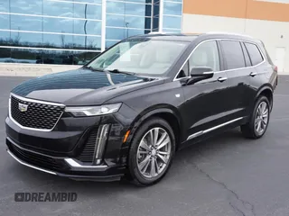 2021 Cadillac XT6 Premium Luxury z VIN 1GYKPDRS3MZ113033, wystawiony jako Copart lot #50076845 z przebiegiem 104 248 mil mil oraz Szkody całkowita. Historia ofert i sprzedaży dostępna na DreamBid. Obrazek 2.