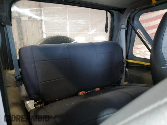 2002 Jeep Wrangler Sport z VIN 1J4FA49S02P730417, wystawiony jako Copart lot #59620865 z przebiegiem Nie podano mil oraz Szkoda całkowita • Salvage title. Historia ofert i sprzedaży dostępna na DreamBid. Obrazek 11.