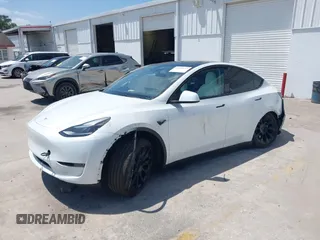 2023 Tesla Model Y Long Range with VIN 7SAYGDEE7PF865539, listed as a IAAI auction lot 42109673 with 34,923 mi miles and . Bid and sale history available at DreamBid. Image 17.
