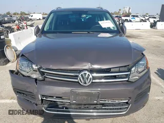 2011 Volkswagen Touareg Sport with VIN WVGFF9BP3BD002517, listed as a IAAI auction lot 42174143 with 156,337 mi miles and . Bid and sale history available at DreamBid. Image 6.