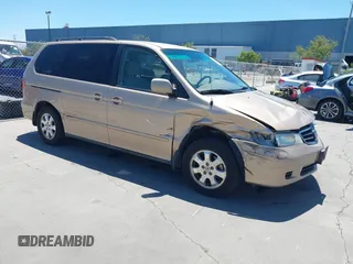 2002 Honda Odyssey EX z VIN 2HKRL18652H580445, wystawiony jako IAAI lot #42338775 z przebiegiem 144 501 mil mil oraz . Historia ofert i sprzedaży dostępna na DreamBid. Obrazek 1.