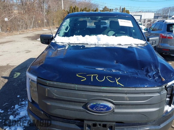 2023 Ford F-150 Lightning Pro with VIN 1FTVW1EL7PWG07081, listed as a IAAI auction lot 38702102 with 9,976 mi miles and . Bid and sale history available at DreamBid. Image 6.