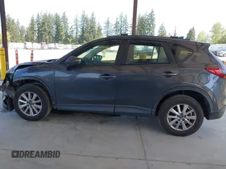 2016 Mazda CX-5 Sport with VIN JM3KE4BY1G0910102, listed as a IAAI auction lot 42115163 with 144,495 mi miles and . Bid and sale history available at carsss.com. Image 15.