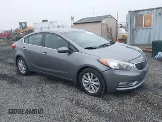 2014 Kia Forte EX with VIN KNAFX4A8XE5213014, listed as a IAAI auction lot 41000589 with 89,890 mi miles. Bid and sale history available at carsss.com. Image 1.