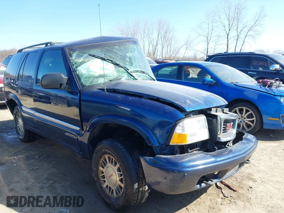 1999 GMC Jimmy SLE with VIN 1GKDT13W3X2553792, listed as a IAAI auction lot 41876489 with 266,884 mi miles. Bid and sale history available at carsss.com. Image 1.