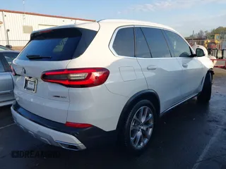 2021 BMW X5 sDrive40i with VIN 5UXCR4C07M9F23816, listed as a IAAI auction lot 41871364 with 55,401 mi miles. Bid and sale history available at carsss.com. Image 4.