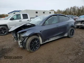 2022 Tesla Model Y Long Range z VIN 7SAYGDEE5NF535525, wystawiony jako Copart lot #76997244 z przebiegiem 100 078 mil mil oraz Szkoda całkowita • Salvage title. Historia ofert i sprzedaży dostępna na DreamBid. Obrazek 1.