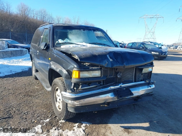1998 Chevrolet Tahoe with VIN 3GNEK18R5WG130358, listed as a IAAI auction lot 41428005 with 218,513 mi miles. Bid and sale history available at carsss.com. Image 6.