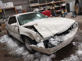 2002 Cadillac Eldorado z VIN 1G6EC12922B105762, wystawiony jako IAAI lot #41591519 z przebiegiem 86 461 mil mil oraz . Historia ofert i sprzedaży dostępna na DreamBid. Obrazek 1.