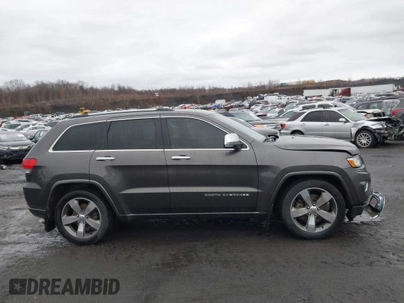 2015 Jeep Grand Cherokee Overland with VIN 1C4RJFCT3FC725239, listed as a IAAI auction lot 41779555 with 100,837 mi miles. Bid and sale history available at carsss.com. Image 13.
