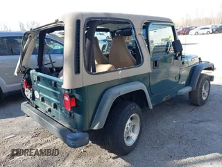2001 Jeep Wrangler Sport with VIN 1J4FA49S31P317597, listed as a IAAI auction lot 41839524 with 145,164 mi miles. Bid and sale history available at carsss.com. Image 4.