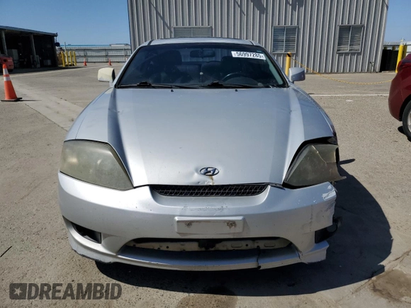 2006 Hyundai Tiburon GT z VIN KMHHN65F26U225506, wystawiony jako Copart lot #56997285 z przebiegiem 170 175 mil mil oraz Szkoda całkowita • Salvage title. Historia ofert i sprzedaży dostępna na DreamBid. Obrazek 5.