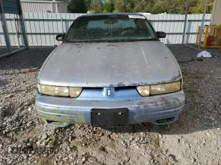 1994 Oldsmobile Cutlass z VIN 1G3WH55M1RD353266, wystawiony jako Copart lot #74058544 z przebiegiem 157 494 mil mil oraz Szkody całkowita. Historia ofert i sprzedaży dostępna na DreamBid. Obrazek 5.