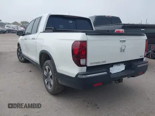 2018 Honda Ridgeline RTL-E with VIN 5FPYK3F77JB004379, listed as a IAAI auction lot 41802025 with 132,085 mi miles and . Bid and sale history available at DreamBid. Image 3.