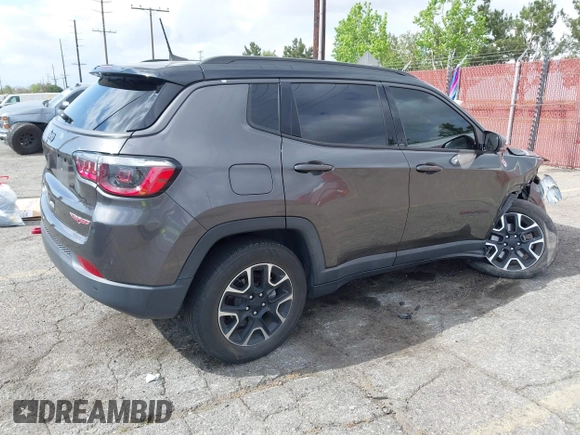 2021 Jeep Compass Trailhawk with VIN 3C4NJDDB6MT561074, listed as a IAAI auction lot 42125886 with 77,293 mi miles and . Bid and sale history available at DreamBid. Image 4.