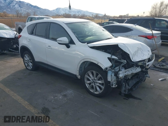 2015 Mazda CX-5 Grand Touring with VIN JM3KE4DY3F0483629, listed as a IAAI auction lot 41054059 with 118,980 mi miles. Bid and sale history available at carsss.com. Image 1.