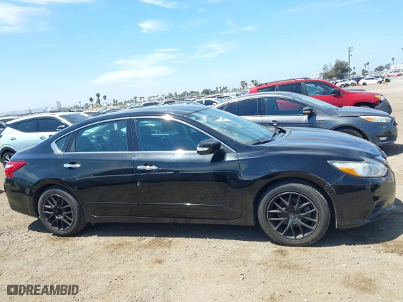2017 Nissan Altima 2.5 SR with VIN 1N4AL3AP9HC151928, listed as a IAAI auction lot 42020334 with 136,101 mi miles. Bid and sale history available at carsss.com. Image 13.