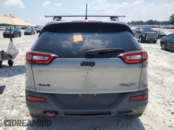 2015 Jeep Cherokee Trailhawk with VIN 1C4PJMBS3FW735398, listed as a Copart auction lot 63700015 with 157,123 mi miles and Clean title. Bid and sale history available at DreamBid. Image 6.