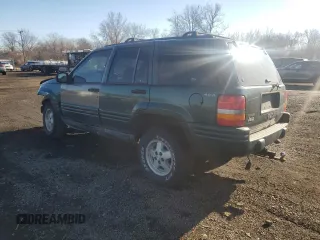 1998 Jeep Grand Cherokee Laredo with VIN 1J4GZ48S4WC239246, listed as a Copart auction lot 86101204 with 0 mi miles and Salvage Title. Bid and sale history available at carsss.com. Image 2.