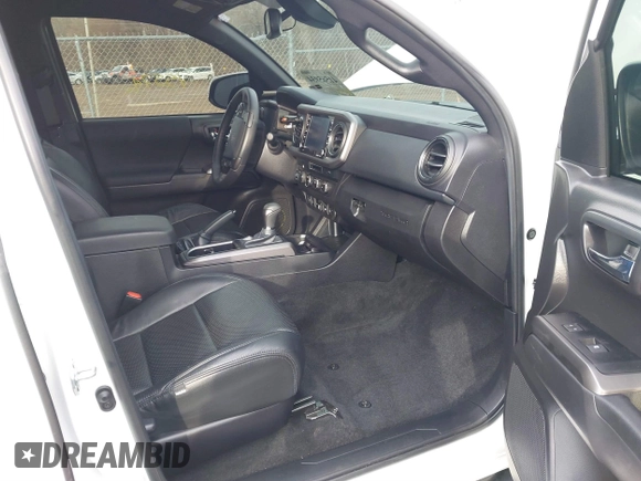 2023 Toyota Tacoma SR5 z VIN 3TMDZ5BN2PM144461, wystawiony jako IAAI lot #41565934 z przebiegiem 75 547 mil mil oraz . Historia ofert i sprzedaży dostępna na DreamBid. Obrazek 5.